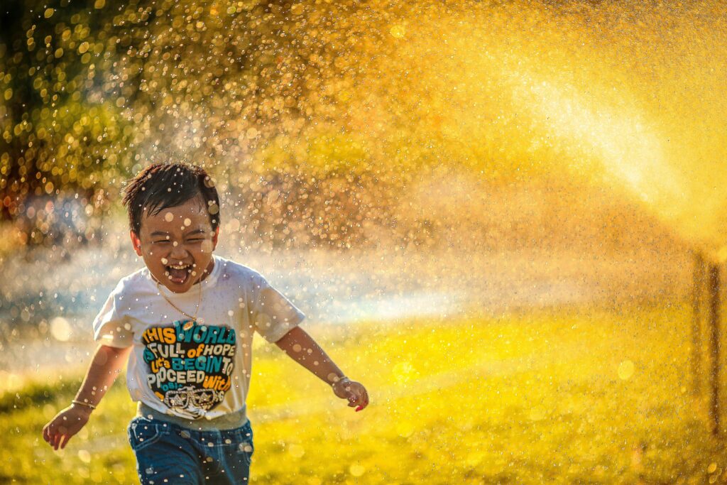 happy kid running in field